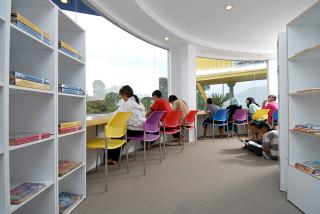 Illustration for article titled Seven Shipping Containers Make Up This Colorful Library